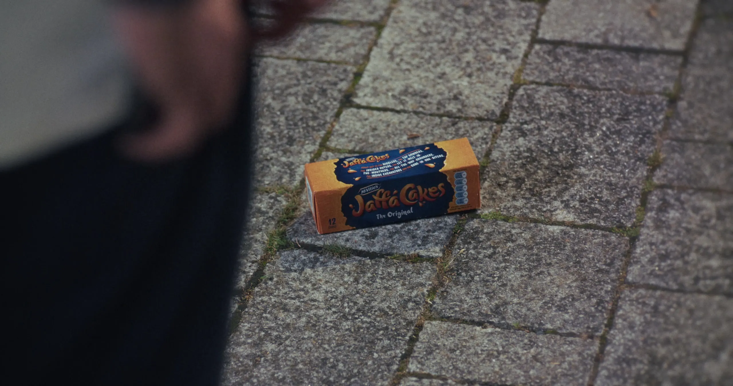 A box of Jaffa Cakes lying on the pavement