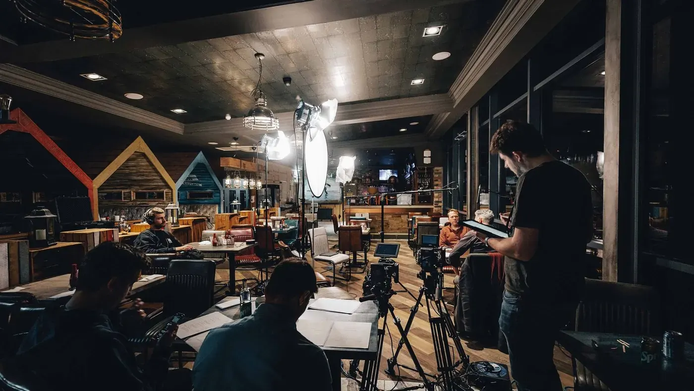 Cast and crew set up among the restaurant tables